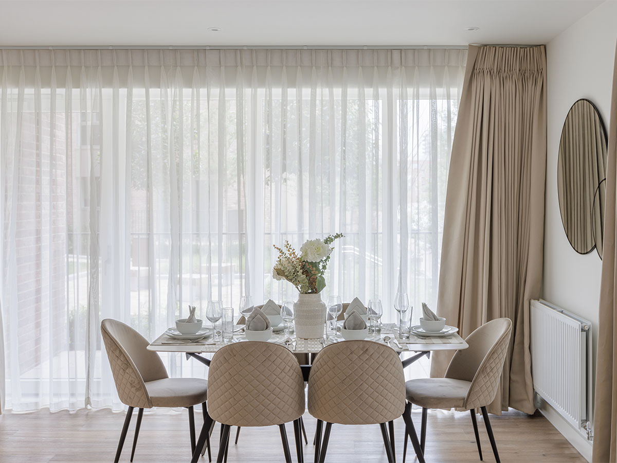 Modern dining room with a large table, chairs, and sheer curtains of Beeley-15