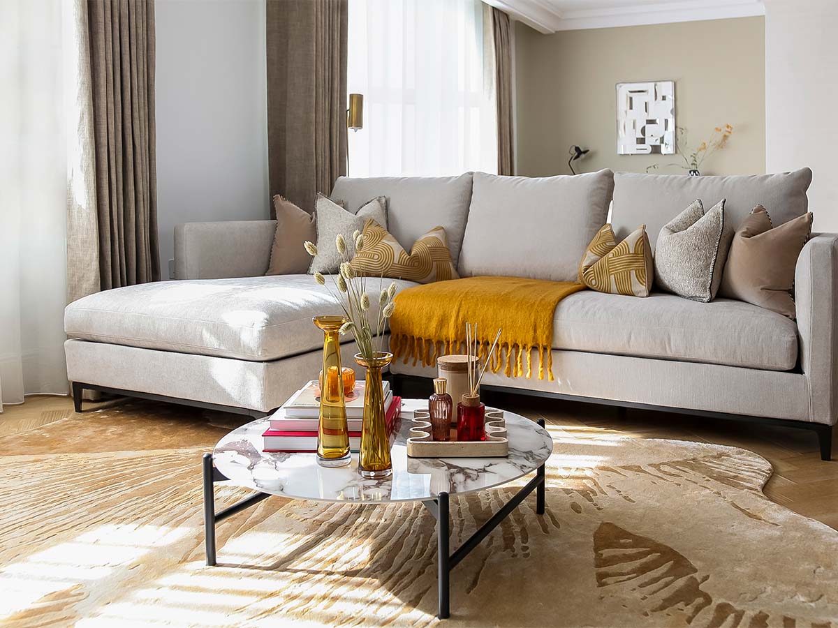 living room with sectional sofa, coffee table, and rug of 9 Milbank