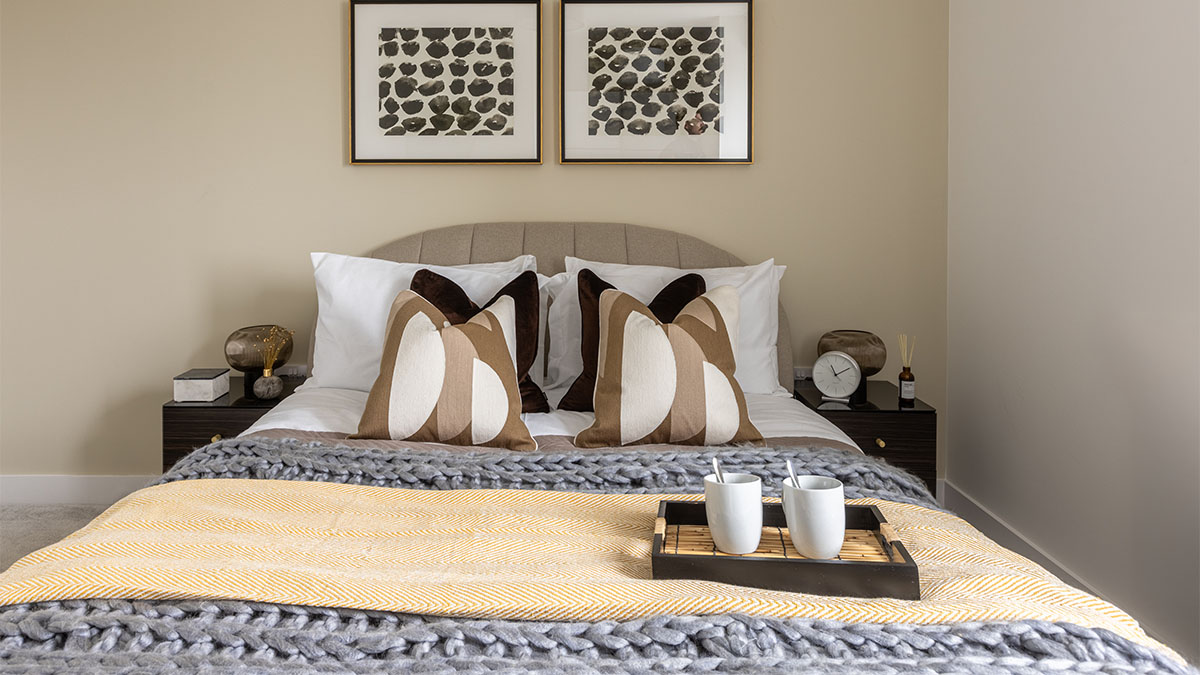 Bedroom with tray, mugs, and blanket at Pintail Heights