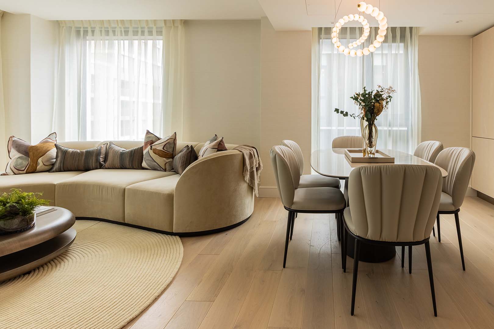 Open living dining - curved sofa and dining set