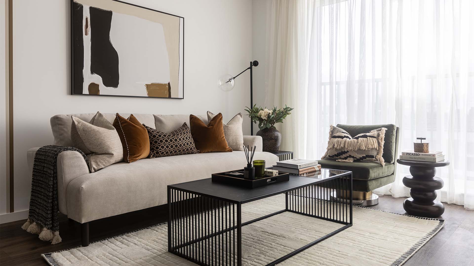 White sofa, green armchair, and black coffee table at W1 place-01 (1)