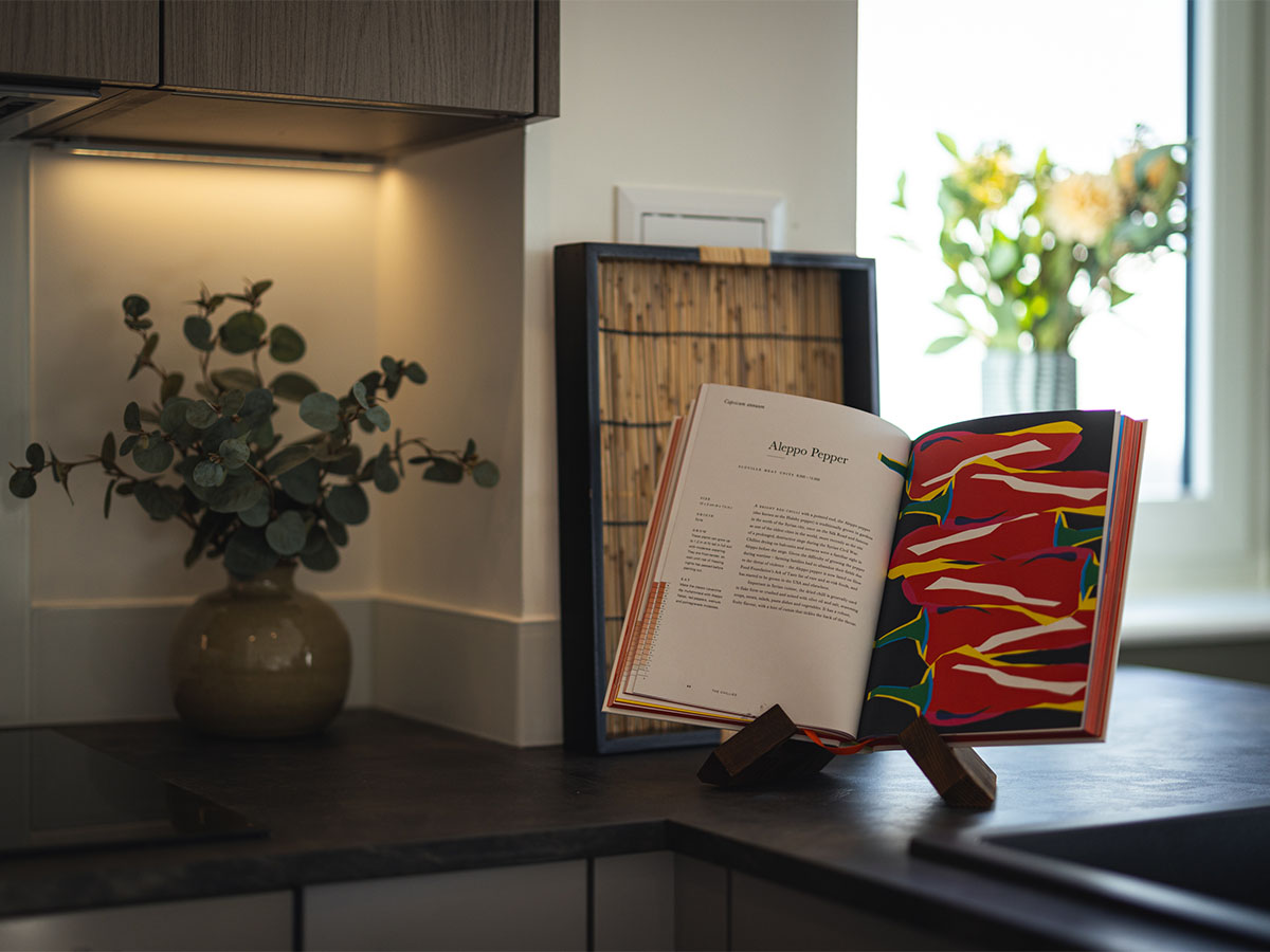 cookbook open to Aleppo Pepper recipe at square roots