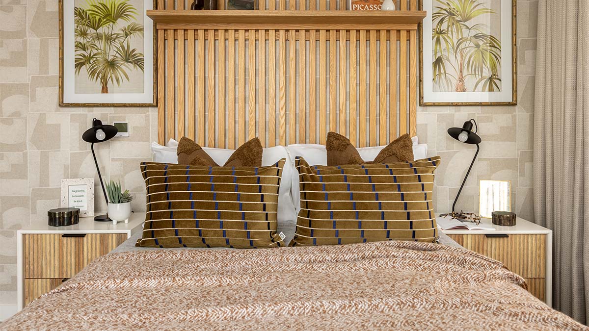 Brown patterned pillows on a modern bed