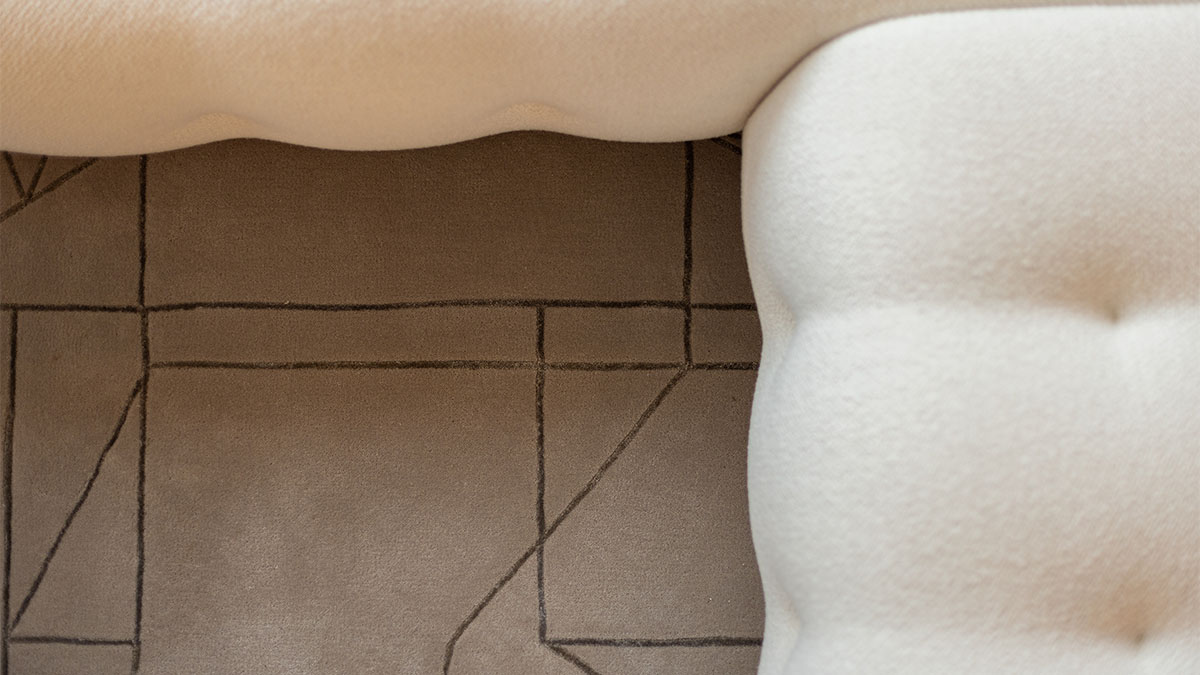 Close-up of plush fabric and patterned rug