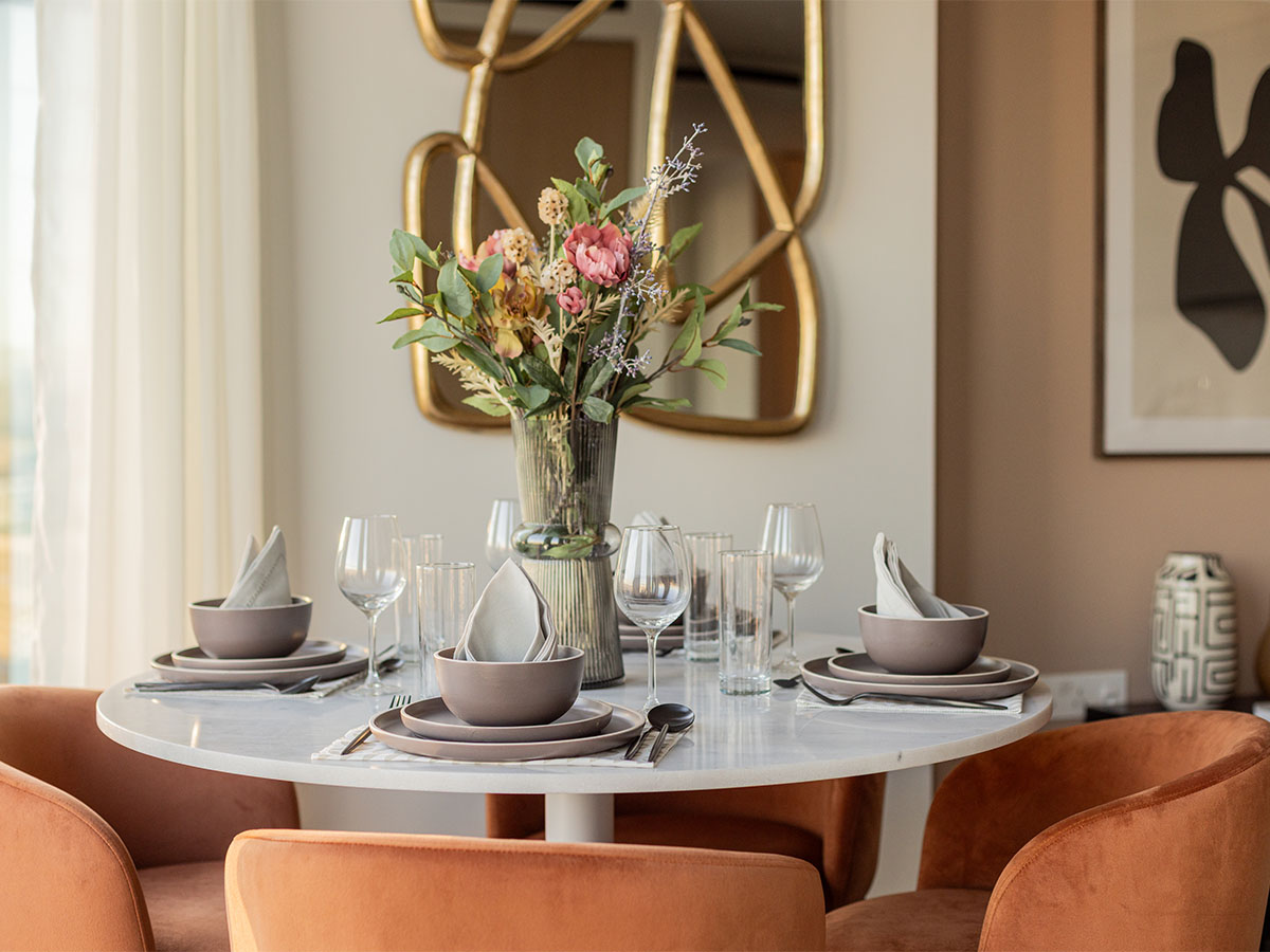 Modern Dining Table Setting with Orange Velvet Chairs