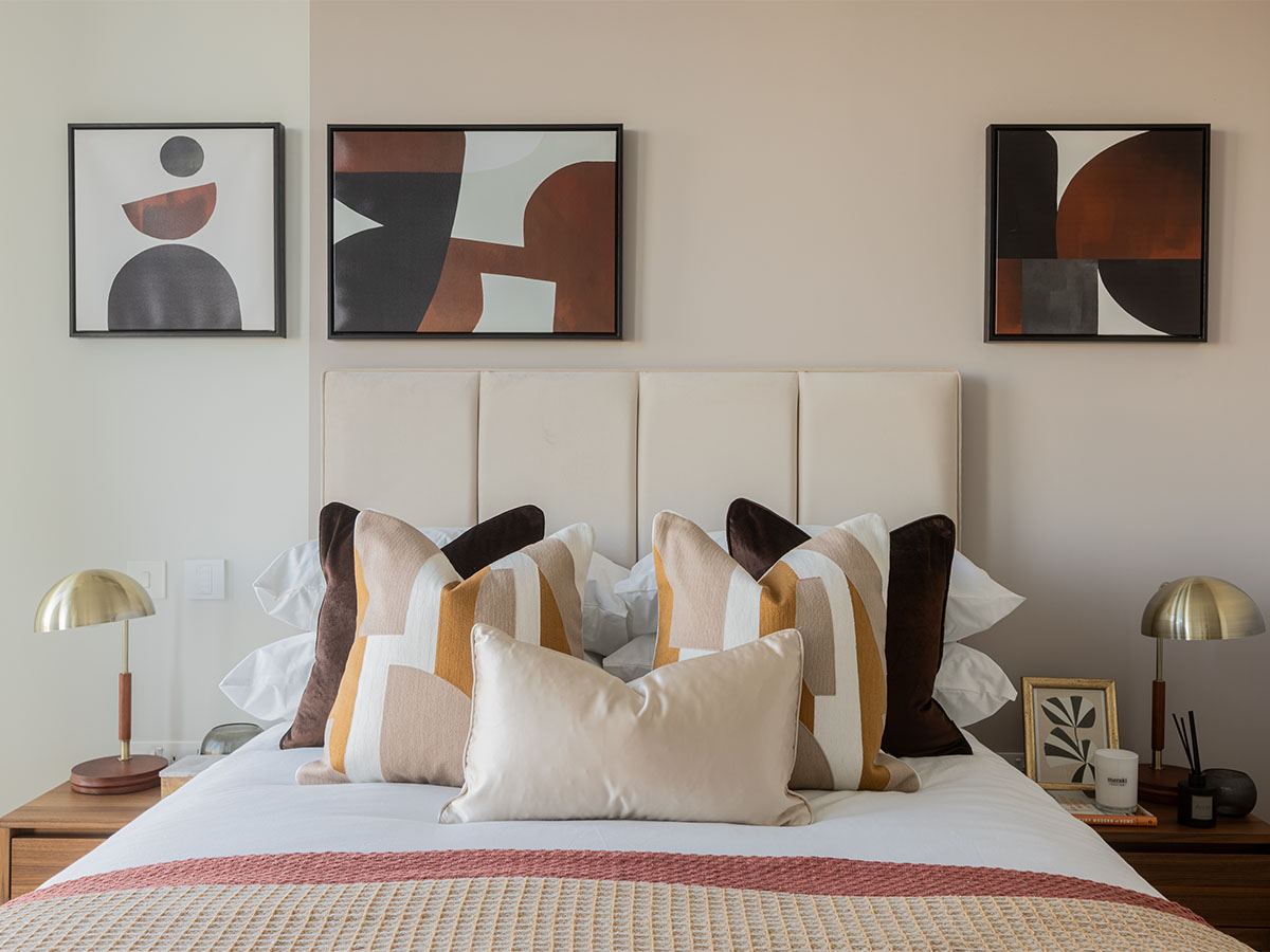 Modern Bedroom with Abstract Art and Pillows