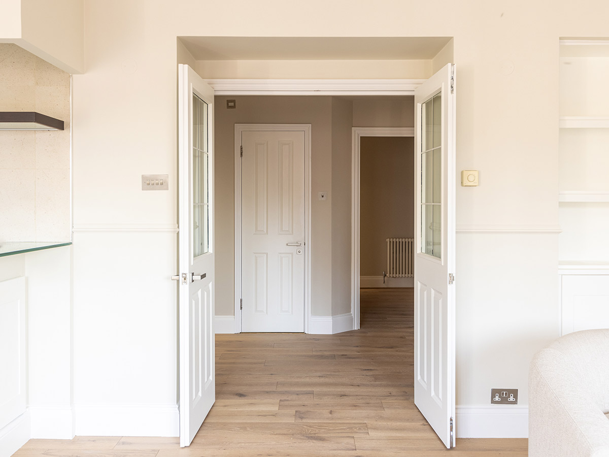 Interior doorway with white frame and doors