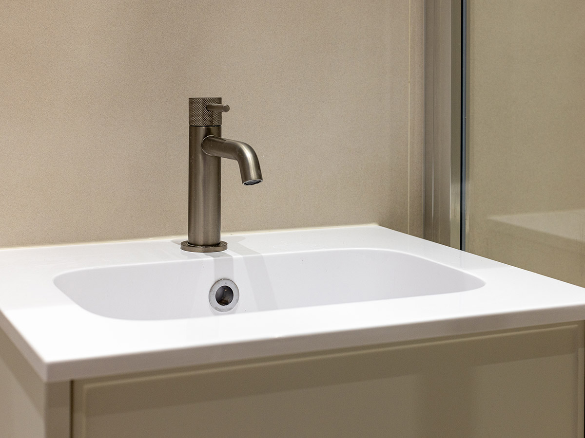 White Logrono basin and brushed metal faucet