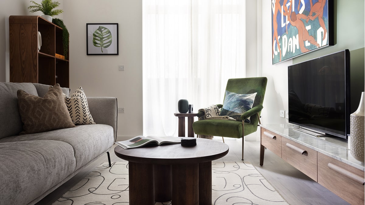 Living Room with Green Armchair and Gray Sofa
