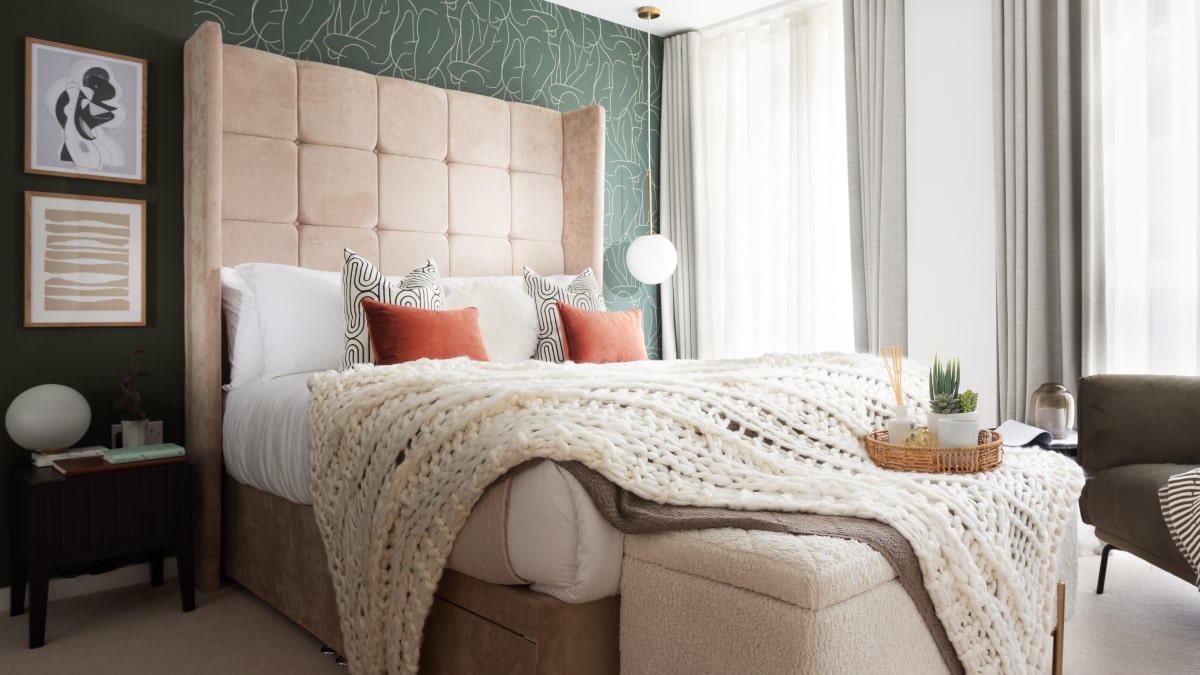 Bedroom with Tall Headboard and Green Wallpaper