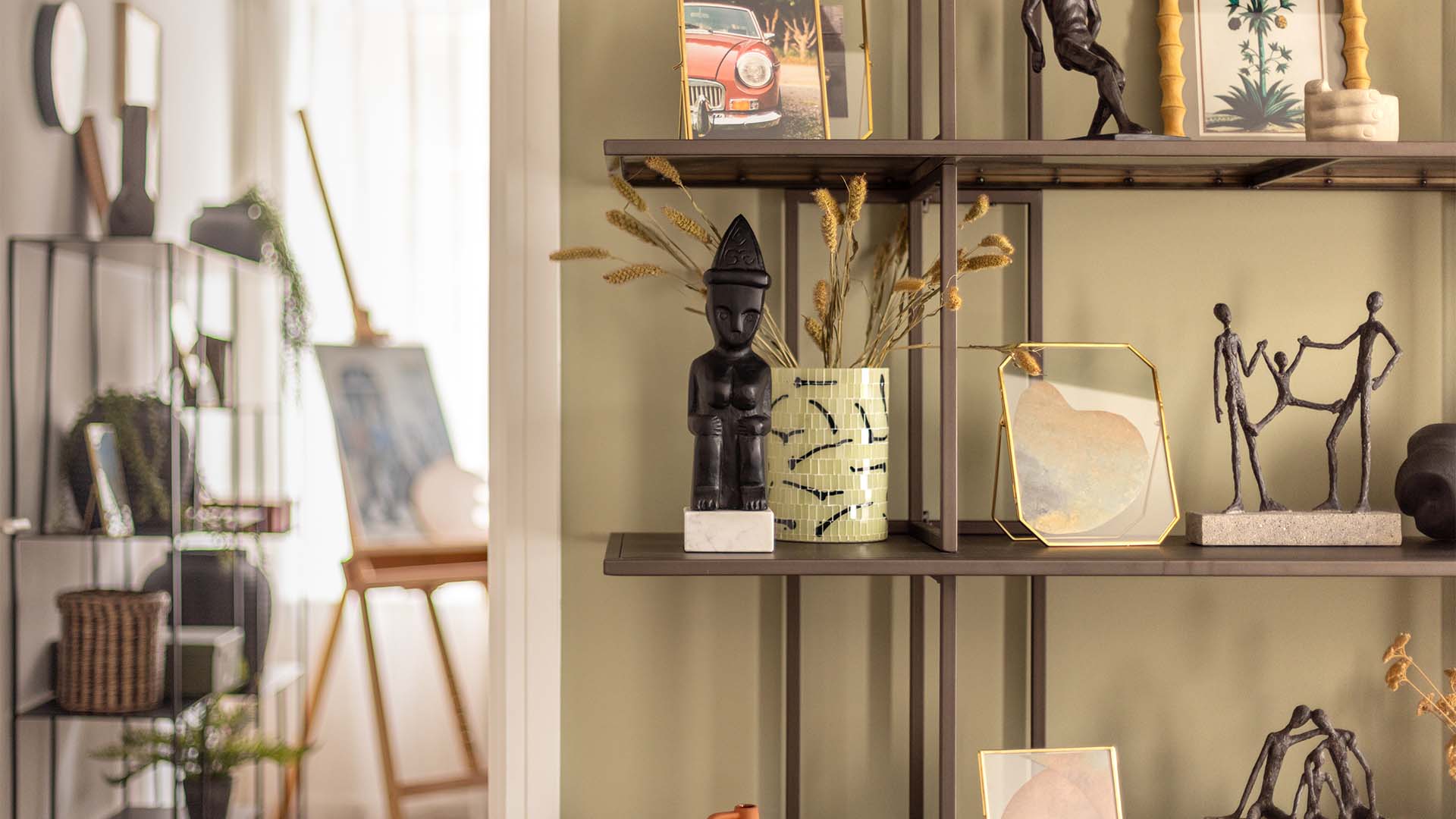 Eclectic decor on modern shelves at Fulton & Fifth