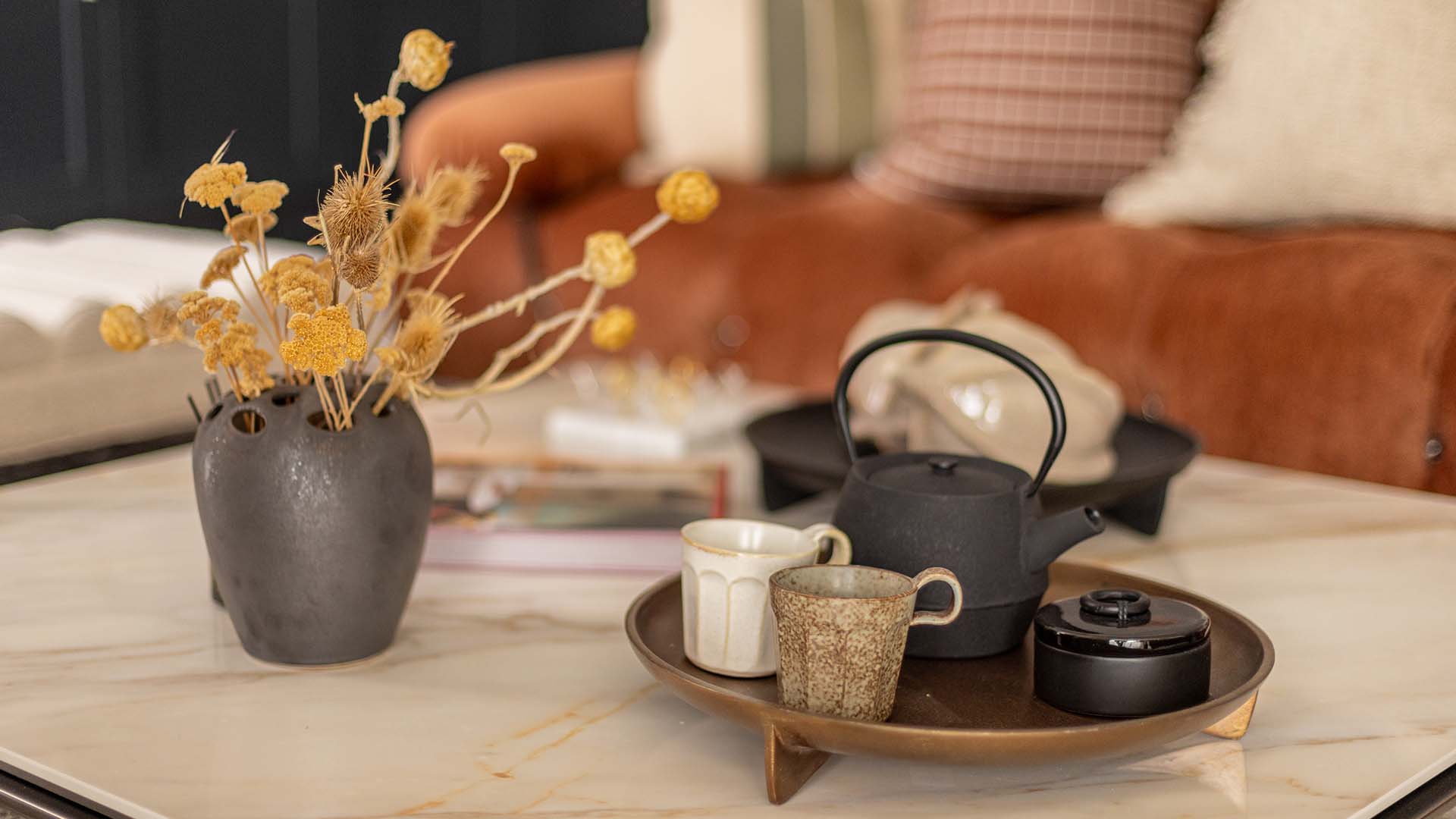 Warm toned coffee table arrangement at Fulton & Fifth