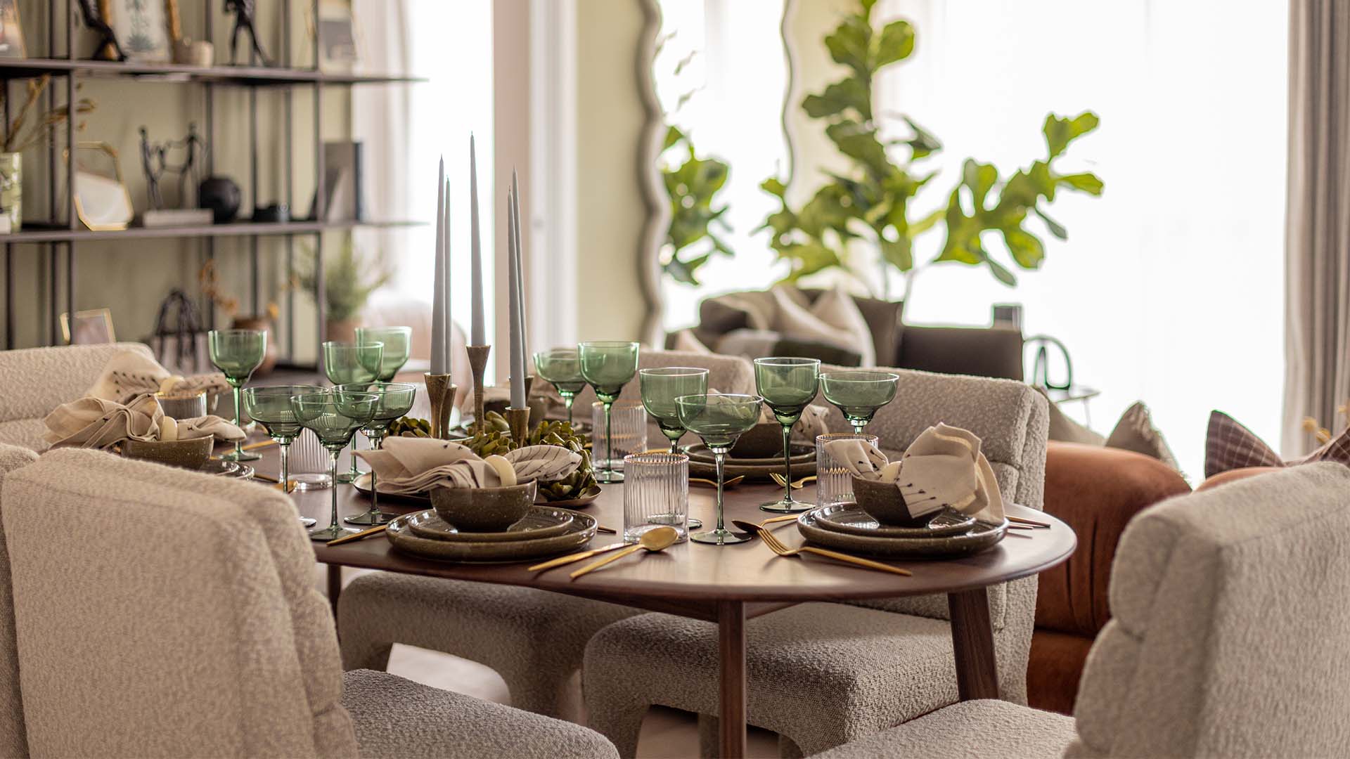 Stylish tableware and green glasses at Fulton & Fifth