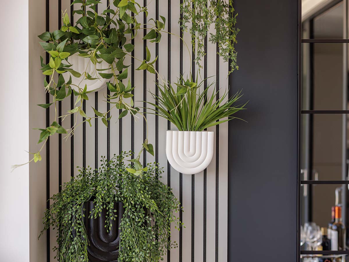Decorative hanging planters and greenery feature at Haydon development