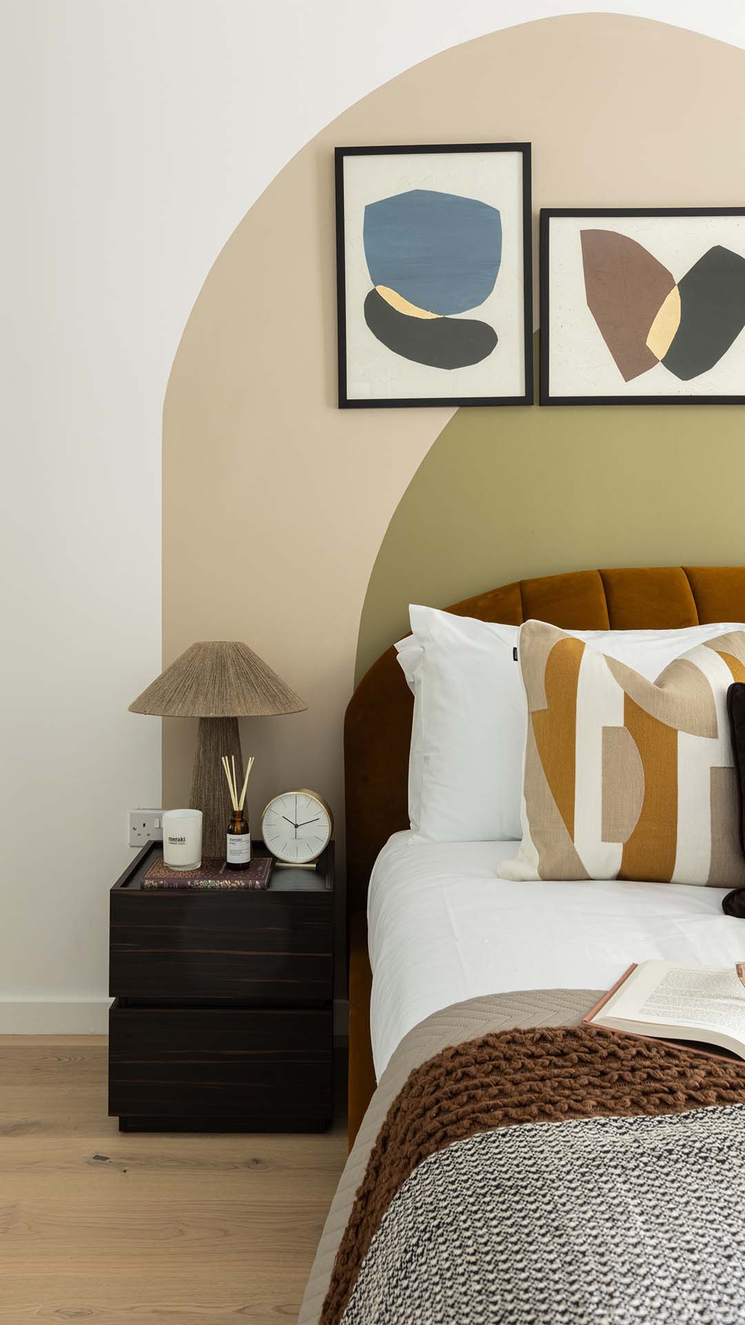 Bedroom with patterned throw and pillows