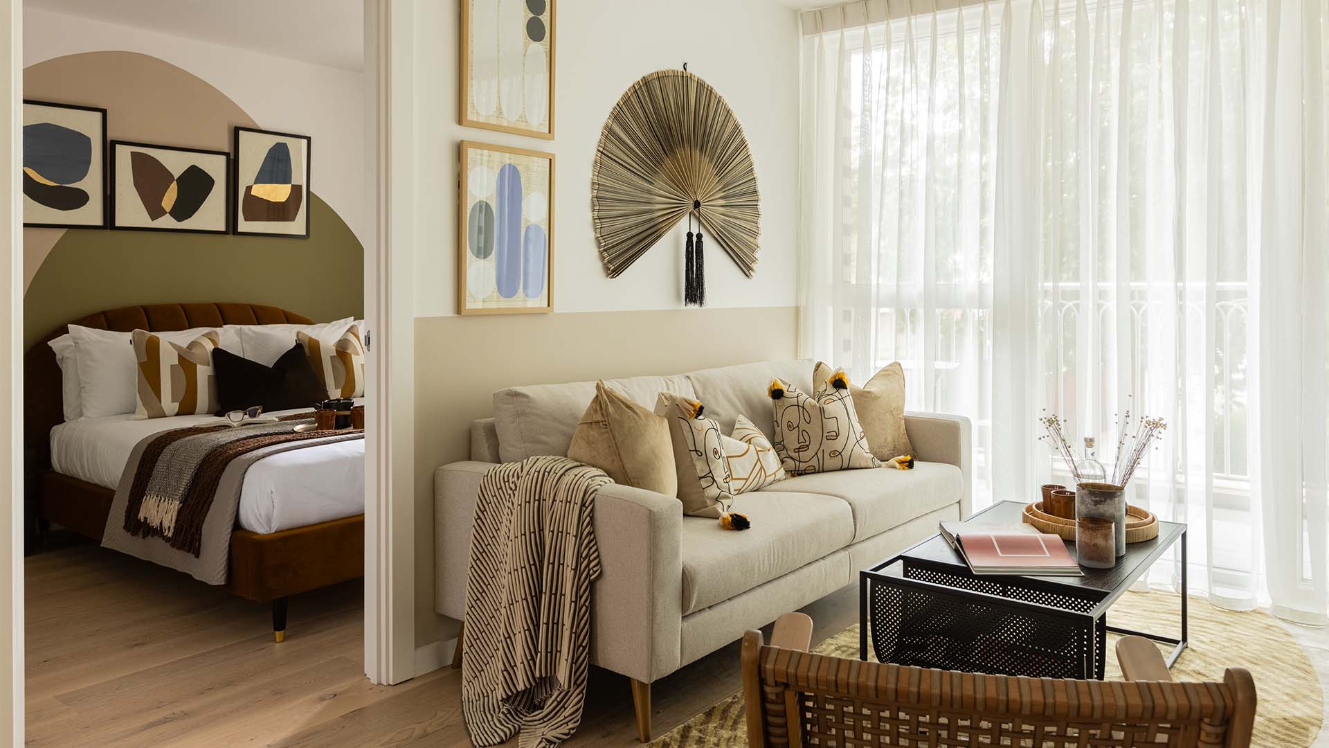 Bed with patterned pillows and soft linens