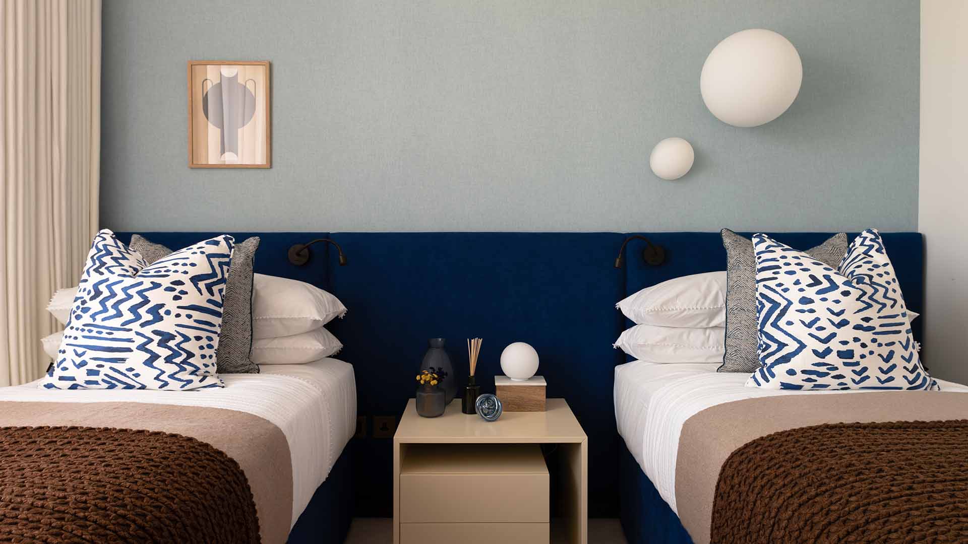 Riverspace Twin Bedroom with Blue Headboard & Decor