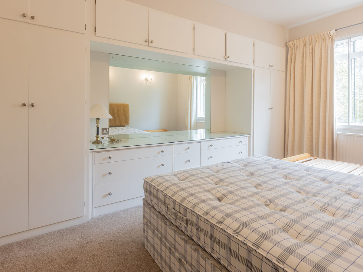 Before: bedroom with built-in wardrobe and mirror