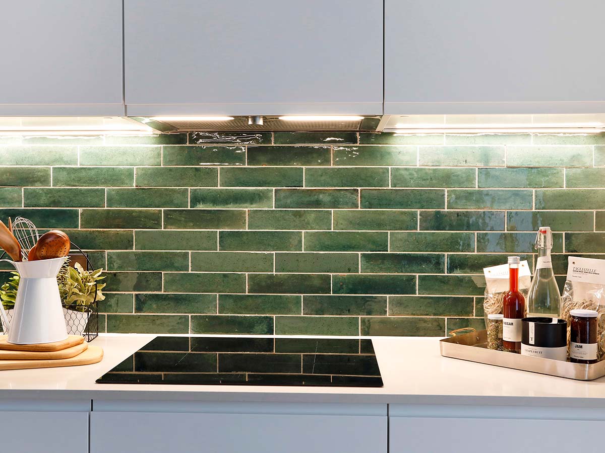 green-subway-tile-backsplash-with-under-cabinet-lighting
