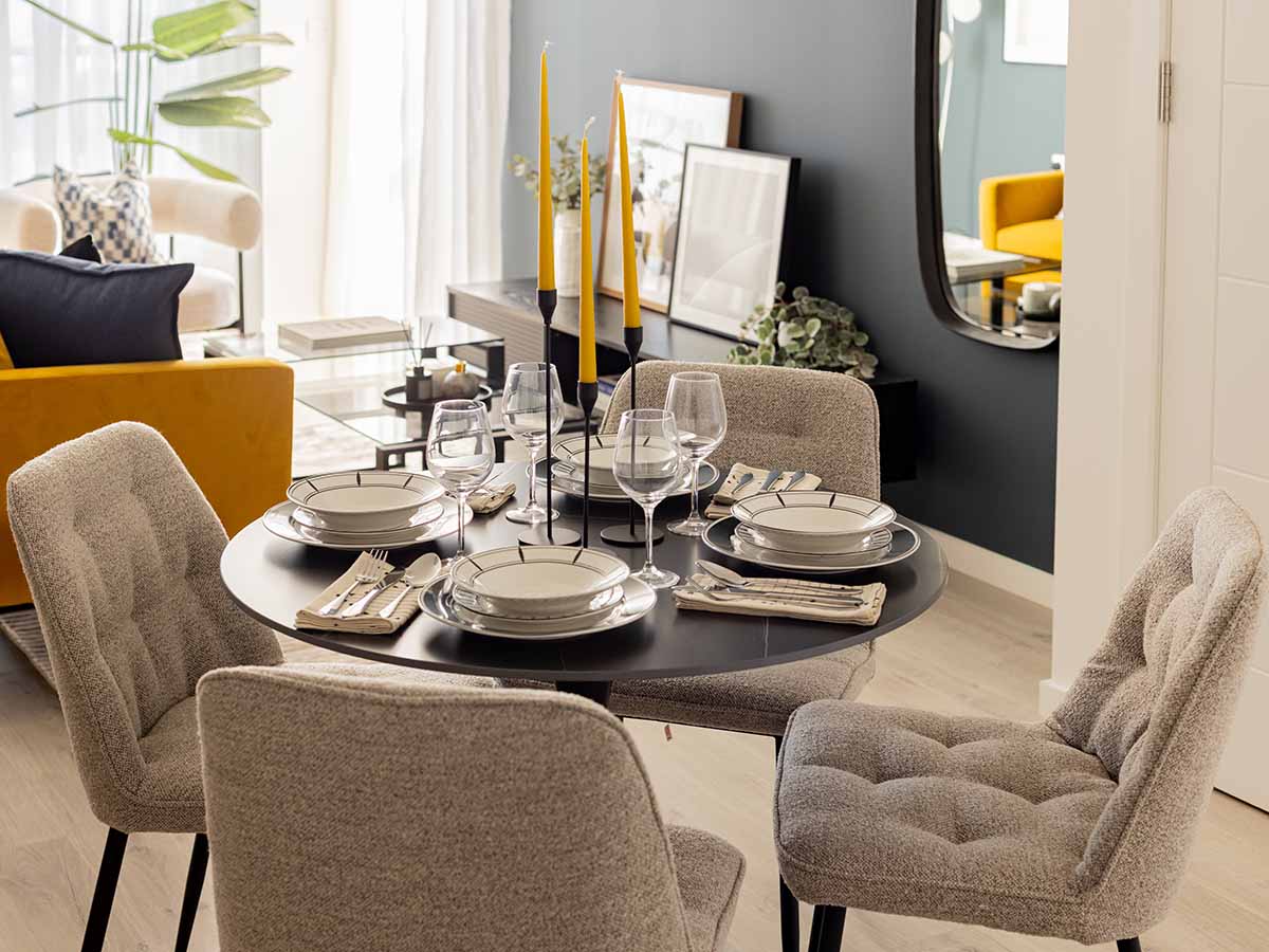 Stylish dining area & living room with yellow sofa