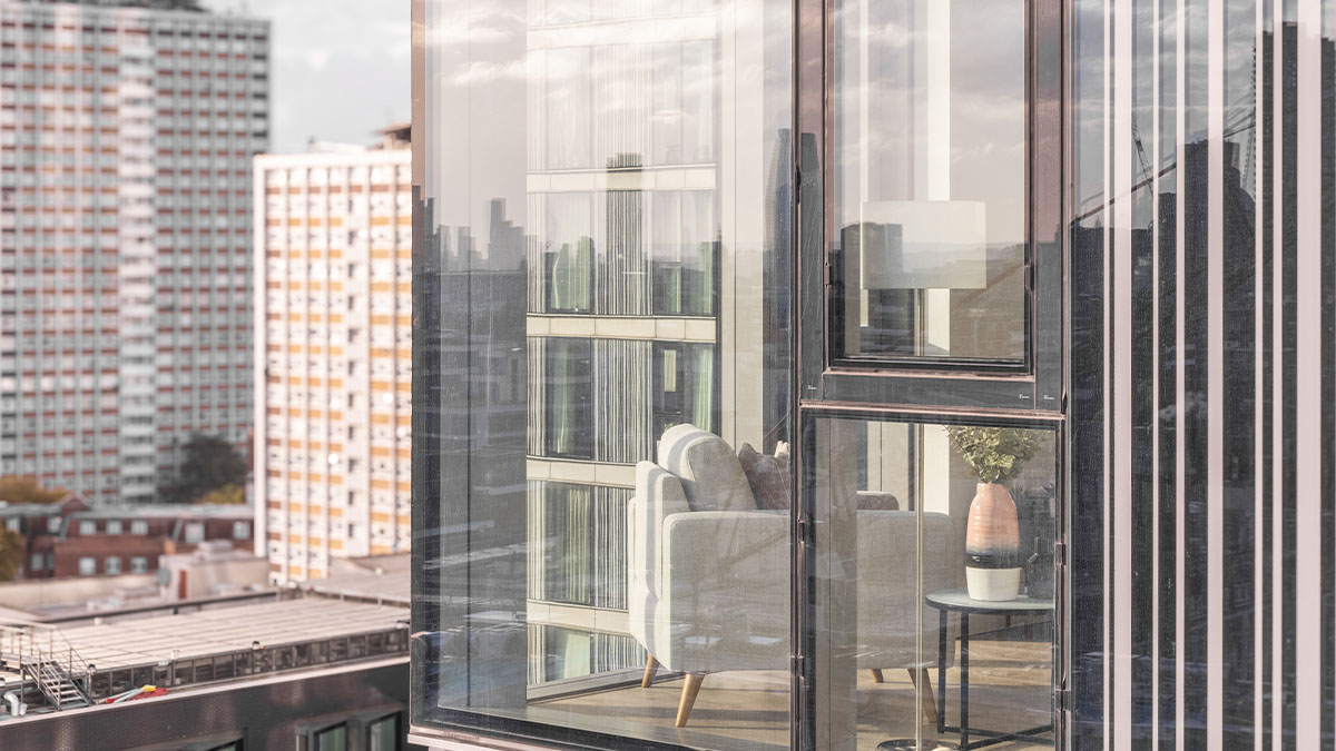 Modern London flat living room with large windows showcasing city views, professionally furnished to enhance rental appeal for overseas investors