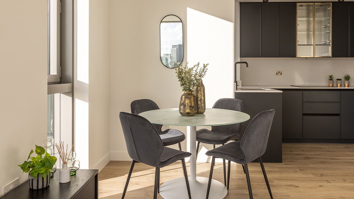 Contemporary dining area and kitchenette in a London flat, part of a professional furnishing package ideal for overseas landlords