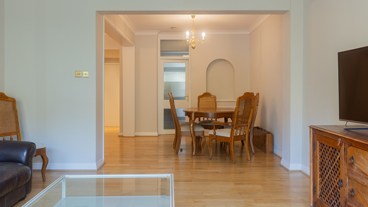 Unfurnished open-plan living and dining area at 48 Montrose Court before styling