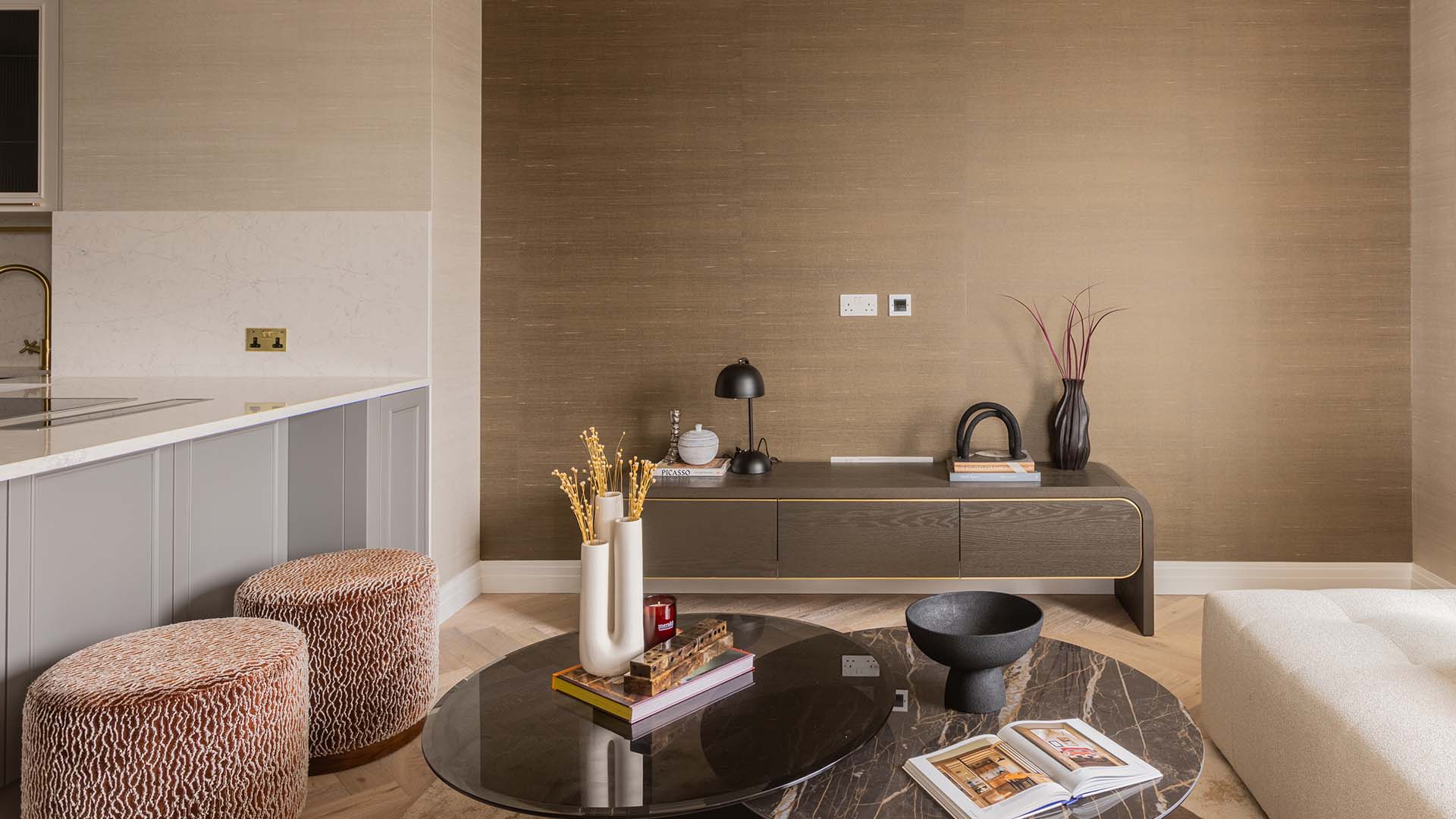Media unit and decorative accents in a Kings Tower Chelsea London flat's living area, professionally styled