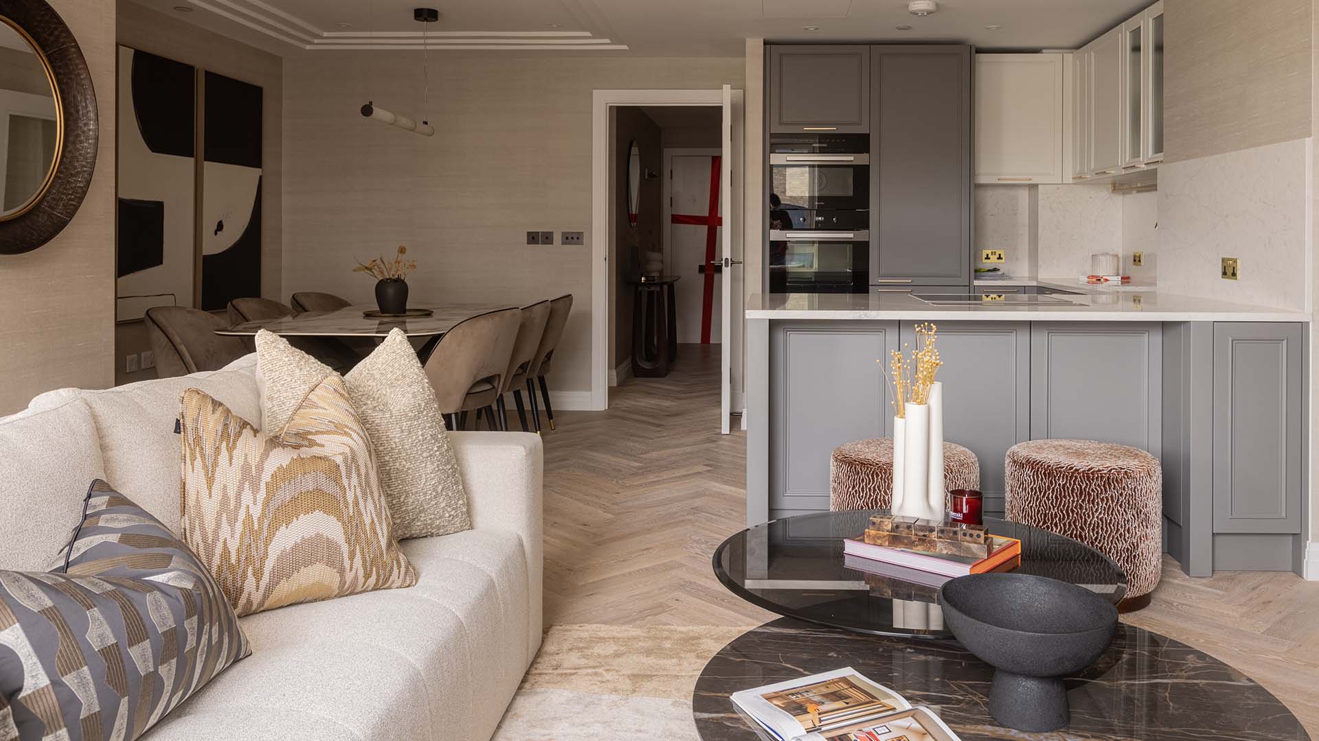 Modern open-plan living room and kitchen in a professionally furnished London flat at Kings Tower, Chelsea