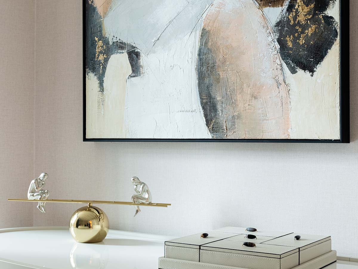 Unique art and decorative items adding sophistication to a London flat, part of professional furnishing