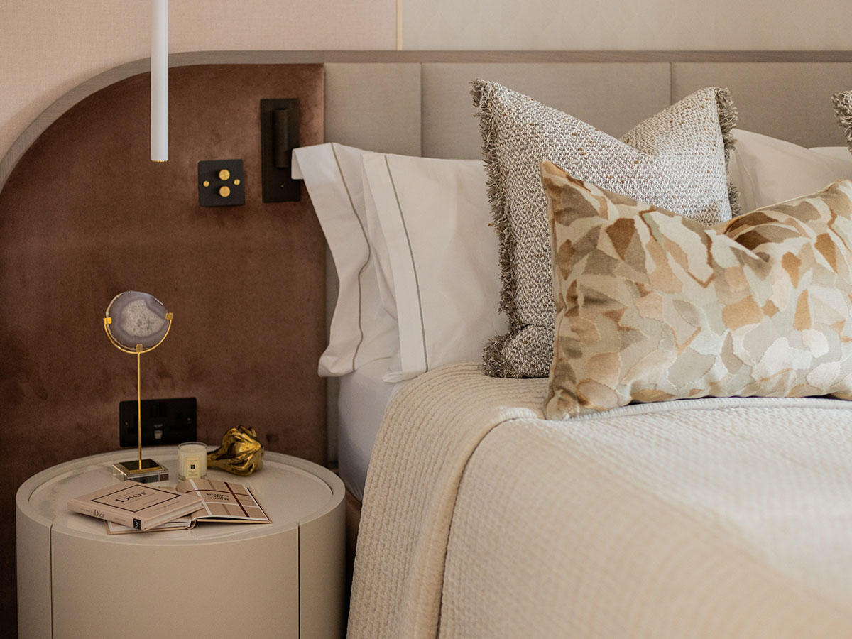 Stylish bedside table with decor, showing attention to detail in professional flat furnishing