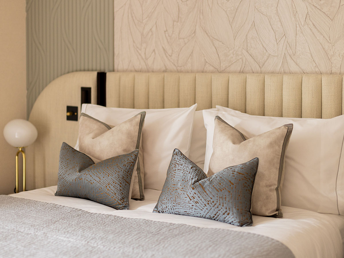 Tastefully arranged pillows on a bed, showcasing quality furnishing packages for London properties