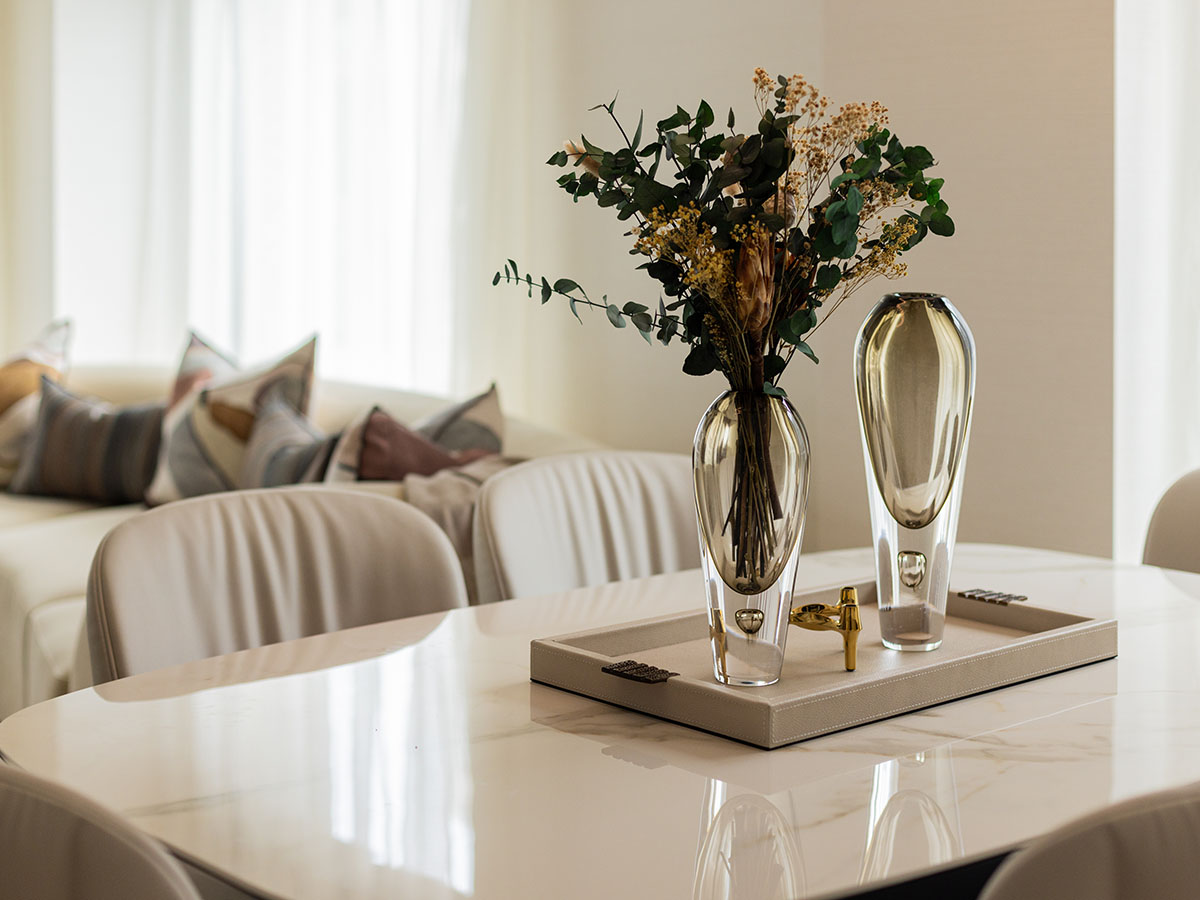 Beautifully staged dining area with elegant vases, showcasing professional furnishing for London flats