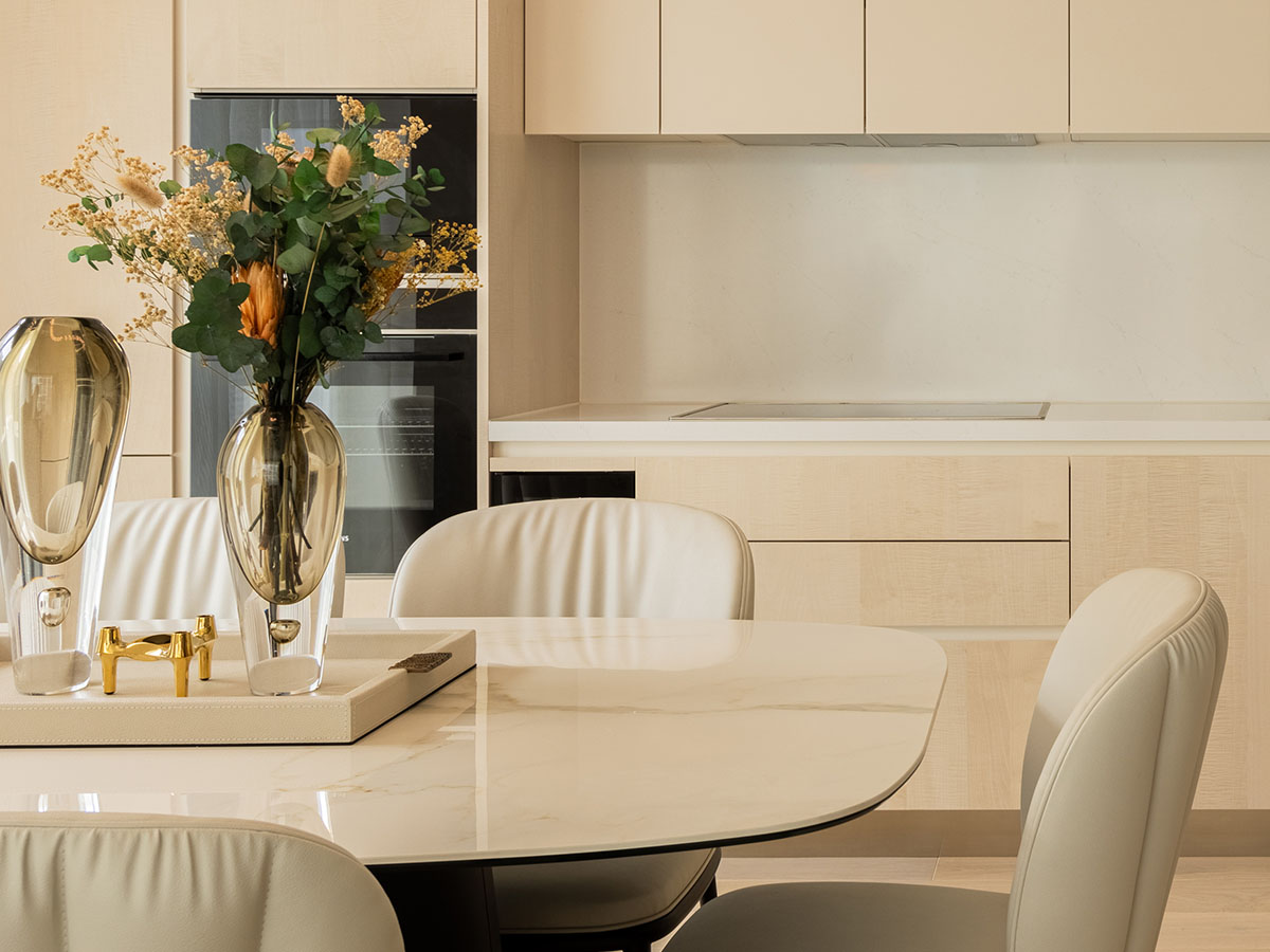 Modern kitchen view from dining area, highlighting the seamless furnishing in a London flat