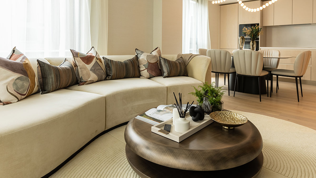 Stylish open-plan living and dining area in a London flat, showcasing coordinated furniture and elegant window dressings, ideal for attracting high-quality tenants