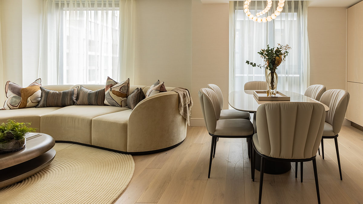Bright open-plan living and dining area in a London apartment, demonstrating how professional furnishing packages create inviting and coordinated spaces for tenants