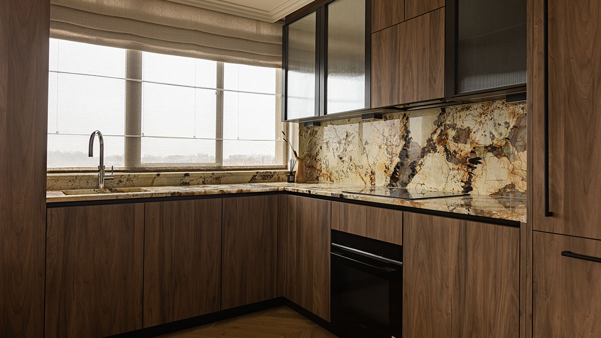 Sleek wood and marble kitchen, showcasing a modern London flat transformation ideal for overseas investors