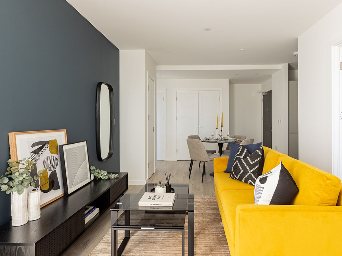 Open-plan living and dining area professionally furnished to appeal to tenants, a key benefit for overseas landlords.
