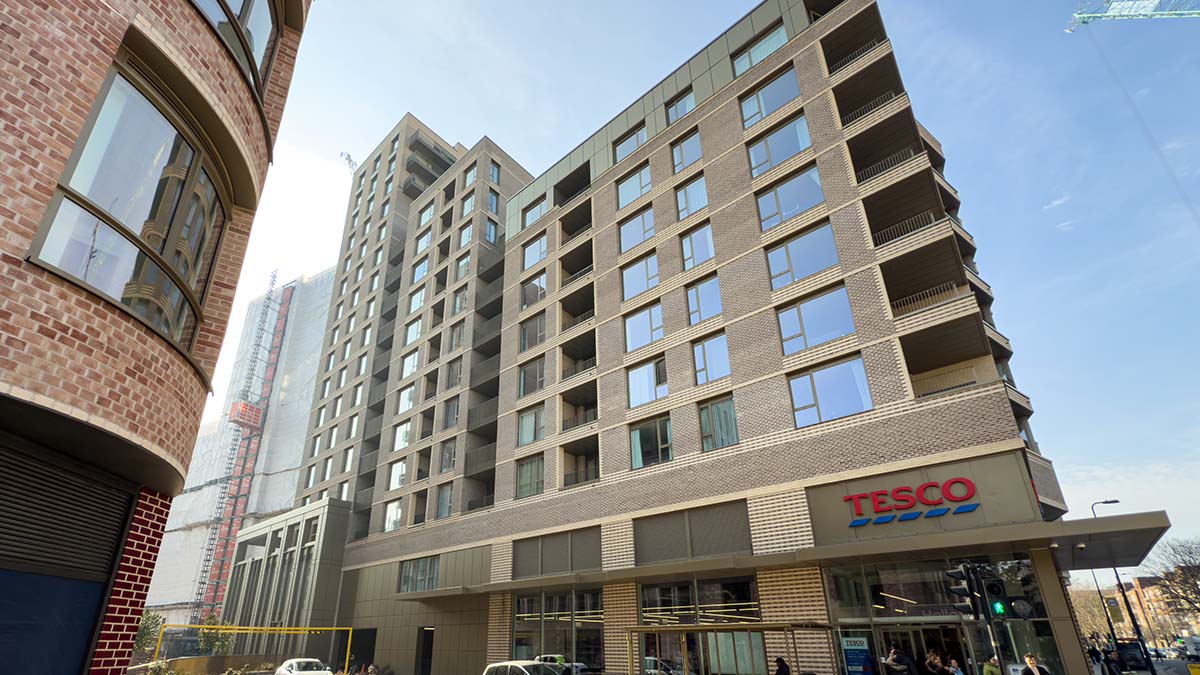 The exterior of the new Juniper Gardens apartment building at Oval Village in Kennington, with a Tesco store conveniently located on the ground floor