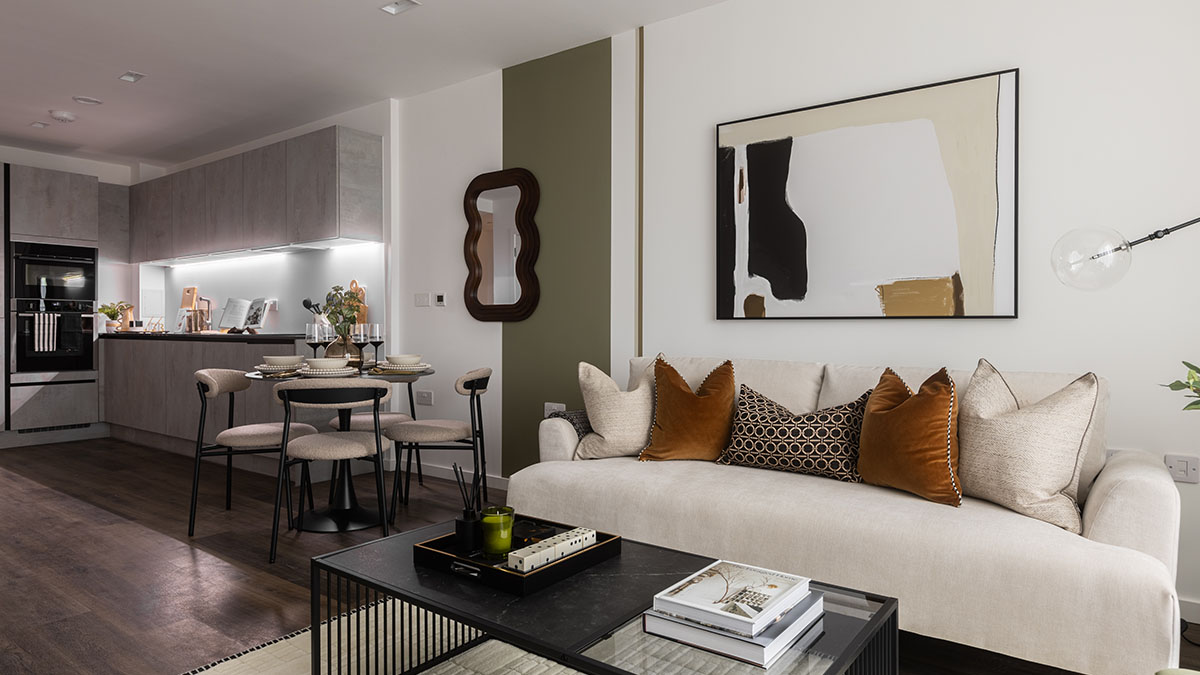 Open-plan living room and kitchen in a London flat, professionally furnished to maximize space and aesthetic appeal