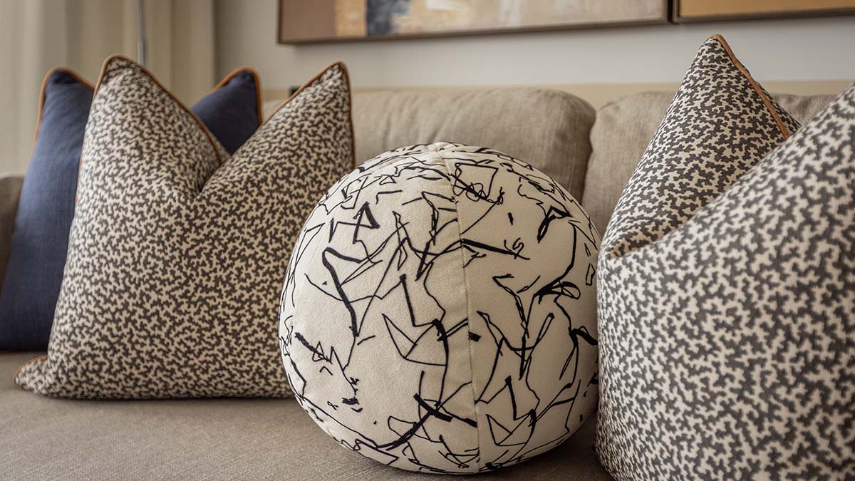 Close-up of decorative pillows on a sofa, showing how professional furnishing adds style to a London flat