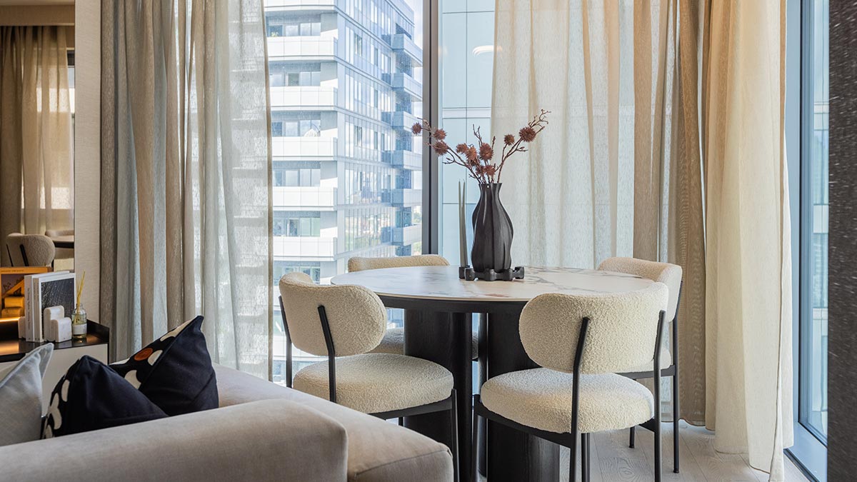 Elegant dining area in a luxury London apartment with modern table and chairs, boosting rental appeal
