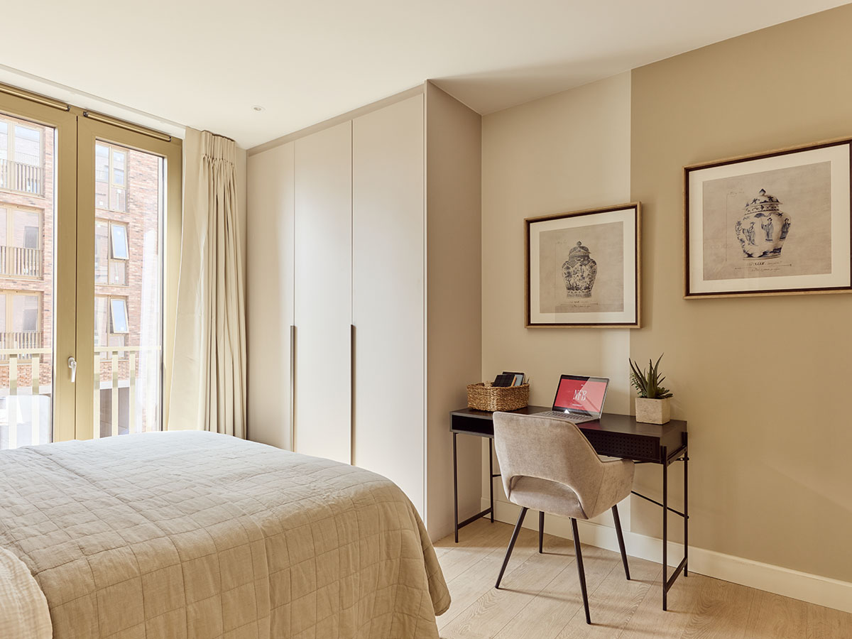 Bedroom with a workspace in a London flat, demonstrating an InStyle Direct furnishing for modern tenants.