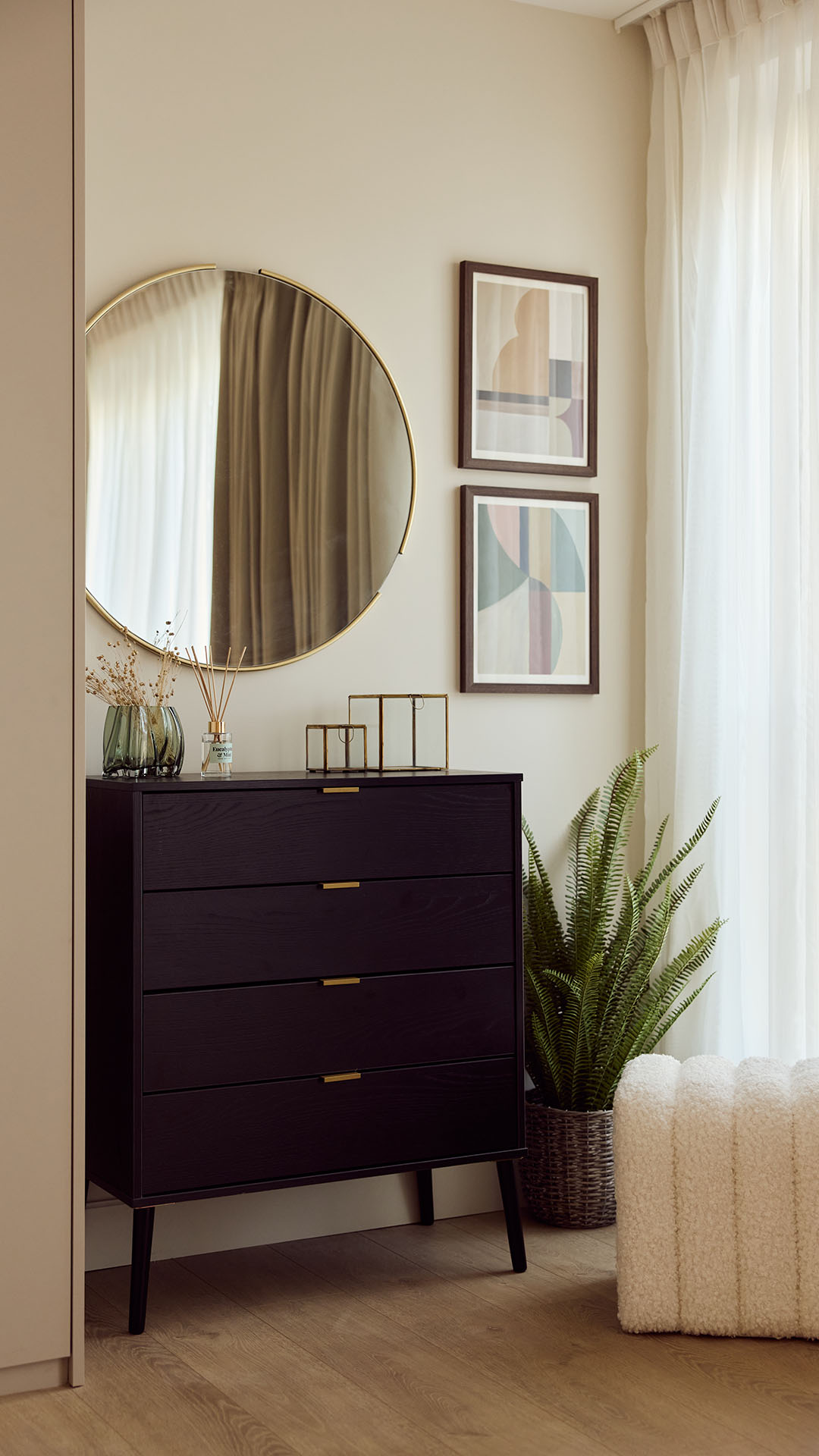 Dark wood dresser and round mirror. Essential furniture in a comprehensive London flat furnishing package.