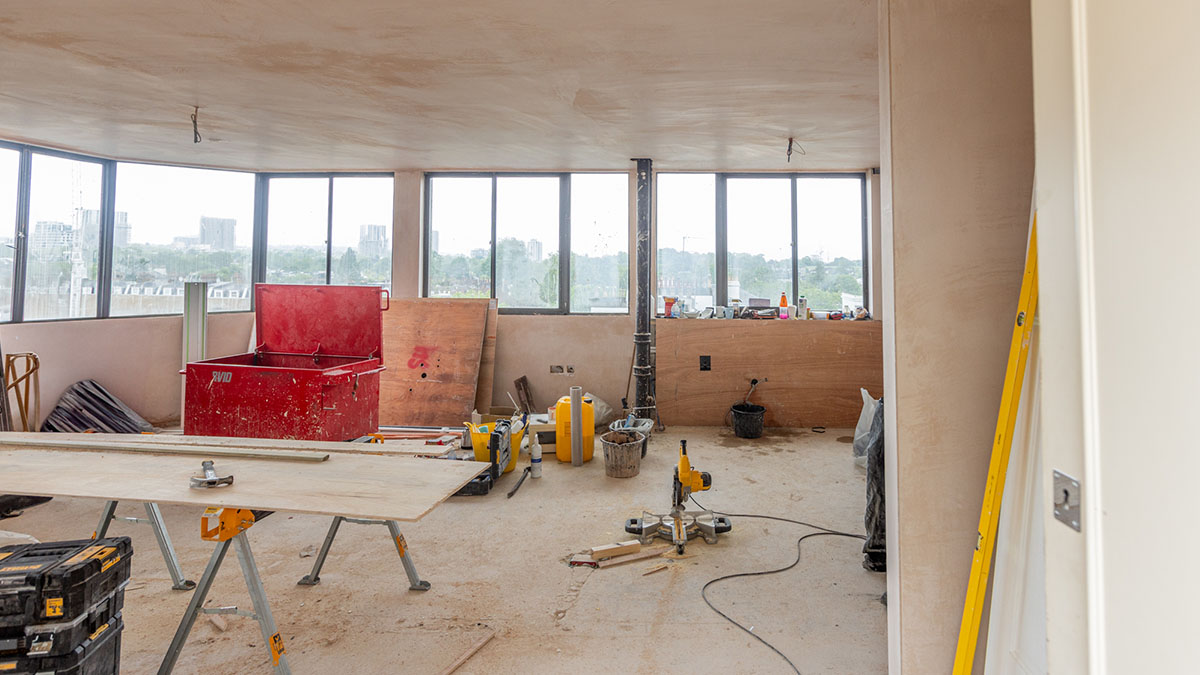 Before: Neutral, empty hallway of a London flat. Highlights the impact of furnishing on a 'before and after London flat' comparison