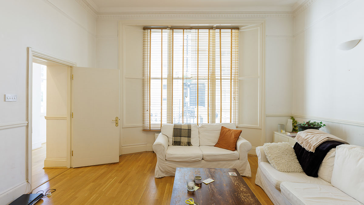 Before: Unfurnished kitchen and dining area in a London flat. Ready for a professional furnishing package and styling
