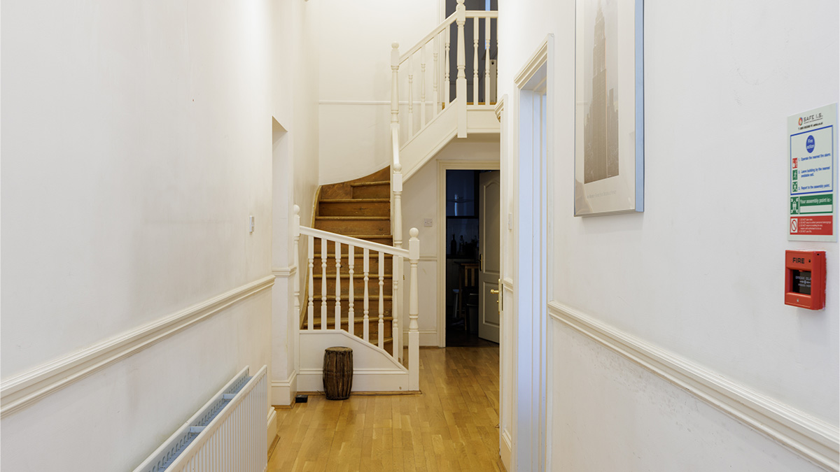 Before: Unfurnished London flat entrance hall awaiting professional refurbishment & furnishing package for investors