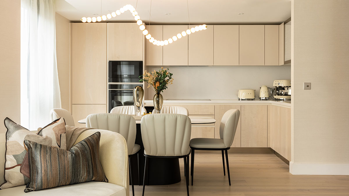 Modern kitchen and dining area with designer lighting, part of a professional furnishing package for London landlords