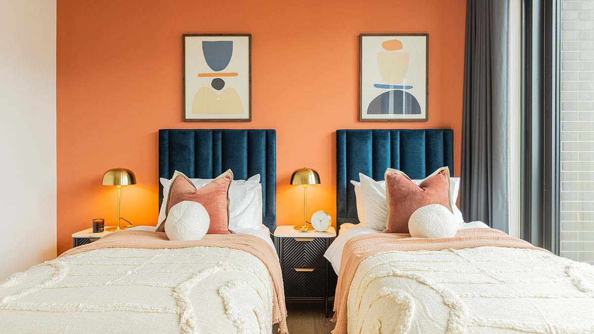 Full view of a stylish twin bedroom, demonstrating professional furnishing impact for London property investors.
