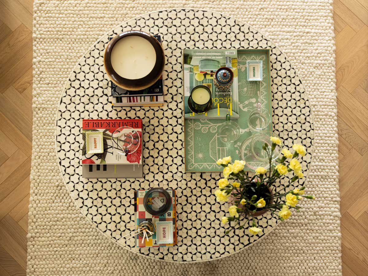 A high-end living space professionally staged by InStyle Direct to maximize appeal for property investors, featuring a luxury sofa, designer lighting, and curated decorative accessories in London.